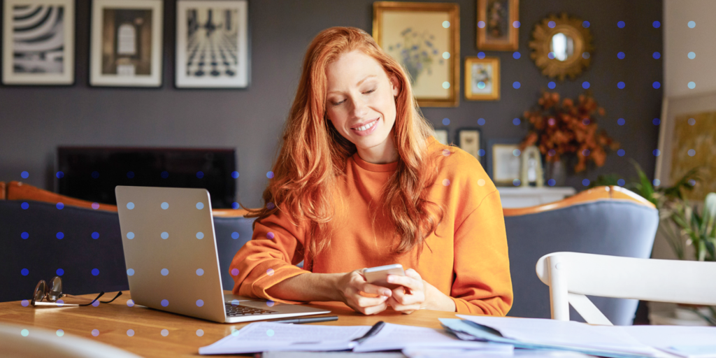 A photo of a woman at her desk.