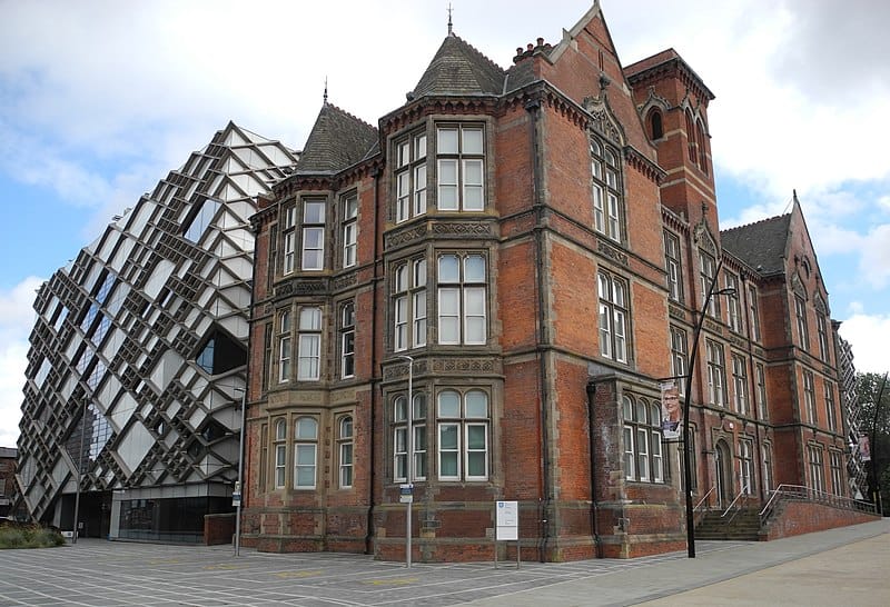 A Victorian brick building (now the Faculty of Music) and a postmodern steel and glass building with diamond-shaped windows on the University of Sheffield campus.